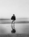 Child on Beach Alone. Vertical in Black and White Royalty Free Stock Photo