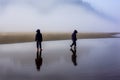 Child on beach in morning fog at low tide Royalty Free Stock Photo