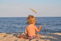 A child at the beach with spikelet