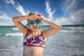 Child at beach with suntan lotion and swim goggles Royalty Free Stock Photo