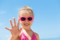 Child beach waving hand summer camp