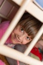 Child behind bars of the crib Royalty Free Stock Photo