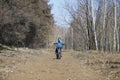 Child on a bicycle on a forest road