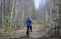 Child on a bicycle on a forest road