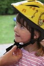 Child with bicycle helmet in yellow