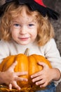 Child with big pumpkin