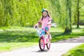 Child on bike. Kids ride bicycle. Girl cycling.