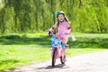 Child on bike. Kids ride bicycle. Girl cycling.