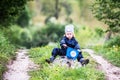 Child on a bike racing through a puddle creating a splash Royalty Free Stock Photo