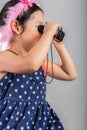 Child with Binoculars / Girl Using Binoculars Royalty Free Stock Photo