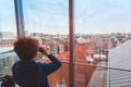 Child looking at roofs of Amsterdam Royalty Free Stock Photo