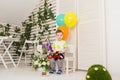 Child, birthday party and childhood concept - Little boy with a balloons and toys indoors Royalty Free Stock Photo