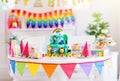 Child birthday party. Kids blow candle on cake Royalty Free Stock Photo