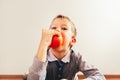 Child biting a tasty apple, isolating white background, concept of healthy nutrition Royalty Free Stock Photo