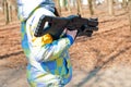 Child with black toy plastic gun for laser tag game standing outdoors Royalty Free Stock Photo