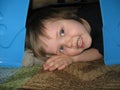 Child in blanket fort Royalty Free Stock Photo