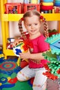 Child with block and construction in play room. Royalty Free Stock Photo