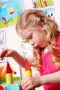 Child with block in play room. Development. Royalty Free Stock Photo