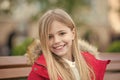 Child with blond long hair smile outdoor