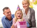 Child, blow or candle for happy birthday, party or cake as fun wish, family or bonding together. Papa, mama or girl or