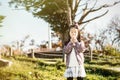 The child blowing a dandelion in a park. Royalty Free Stock Photo