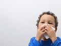 Child blowing nose Royalty Free Stock Photo