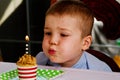 Child blowing out candle
