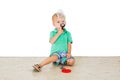 Child blowing soap bubbles in white background