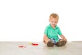 Child blowing soap bubbles in white background