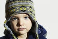 Child with blue eyes.fashion kids.fashionable little boy in winter cap Royalty Free Stock Photo