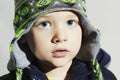 Child with blue eyes.fashion kids.fashionable little boy in winter cap Royalty Free Stock Photo