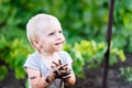 Child playing in the mud on the street Royalty Free Stock Photo