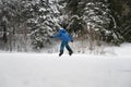 Child in blue winter suit ice skating on a natural ice Royalty Free Stock Photo