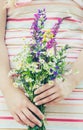 Child with a bouquet of wildflowers. Selective focus. nature Royalty Free Stock Photo