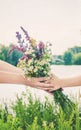 Child with a bouquet of wildflowers. Selective focus. nature Royalty Free Stock Photo