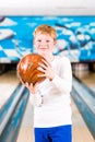 Child bowling with ball Royalty Free Stock Photo