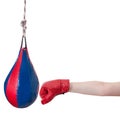 Child with boxing glove punches punching bag Royalty Free Stock Photo