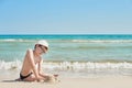 Child boy on beach. Rest on vacation, play in sand against sea. Tourism and vacation on ocean. Family vacation in summer. Vacation Royalty Free Stock Photo