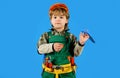 Child boy in builder uniform with tool belt. Tools for building. Little kid in overalls and safety helmet with builders Royalty Free Stock Photo