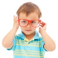 Child, boy and cool frames or glasses in studio, eyes and vision support by white background. Male person, kid and