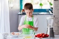 Child boy cracking egg and separating the yolk Royalty Free Stock Photo