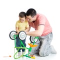 Child boy and daddy fixing bisycle Royalty Free Stock Photo