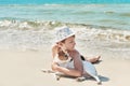 Child boy with dog jack russel on beach. Best friends rest on vacation, play in sand against sea. Tourism and vacation on ocean. Royalty Free Stock Photo