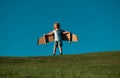 Child boy dreams and travels. Boy with airplane toy outdoors. Happy child playing with toy airplane outdoors in summer Royalty Free Stock Photo