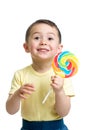 Child boy eating big candy lollipop isolated Royalty Free Stock Photo