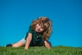 Child boy enjoying on grass field and dreaming. Royalty Free Stock Photo