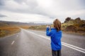 Child, enjoying the vew of the majestic nature in Iceland on a beautiful autumn day