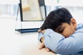 Child boy falls asleep at table classroom. kid pupil education lesson study elementary at desk. Little boy tired sleep after Royalty Free Stock Photo