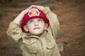Child Boy with Fireman Hat Playing Outside Royalty Free Stock Photo