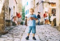 Child boy with Fritule - Croatian sweet pastry, cookies, homemade fritters Royalty Free Stock Photo